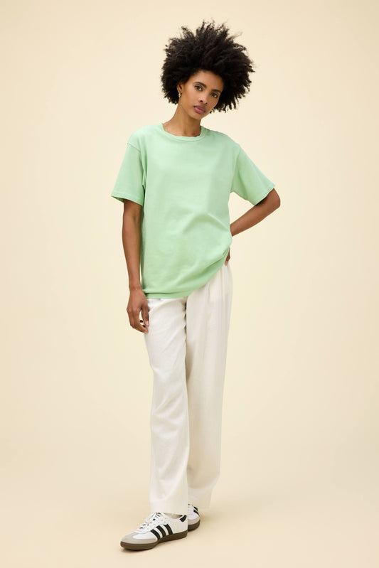 A model featuring a weekend tee in mint spray.