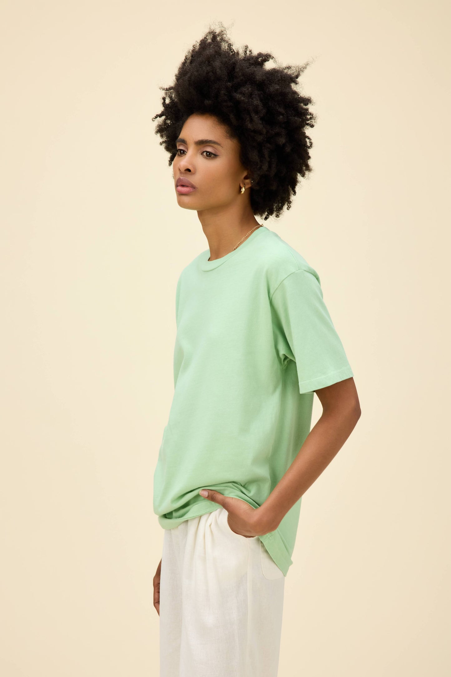 A model featuring a weekend tee in mint spray.