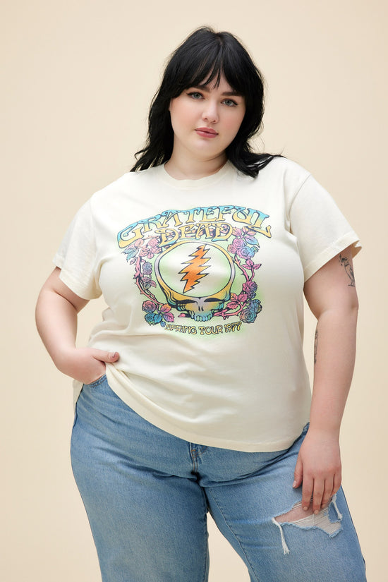 A plus size model featuring a white tour tee stamped with 'Grateful Dead'
