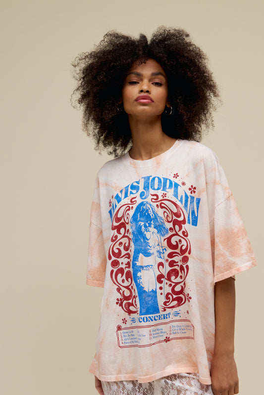 A model featuring an OS tee stamped with 'Janis Joplin Concert' and a portrait of the singer on the middle.