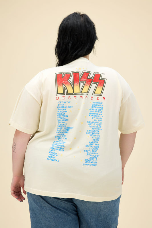 A model featuring a white plus size merch tee stamped with 'KISS' in large font.