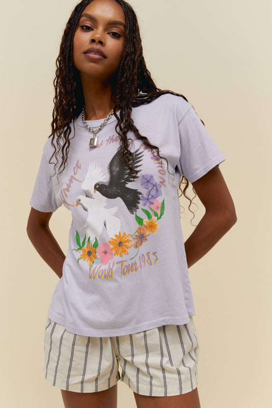 A model featuring a lilac ringer tee  design with white and black dove