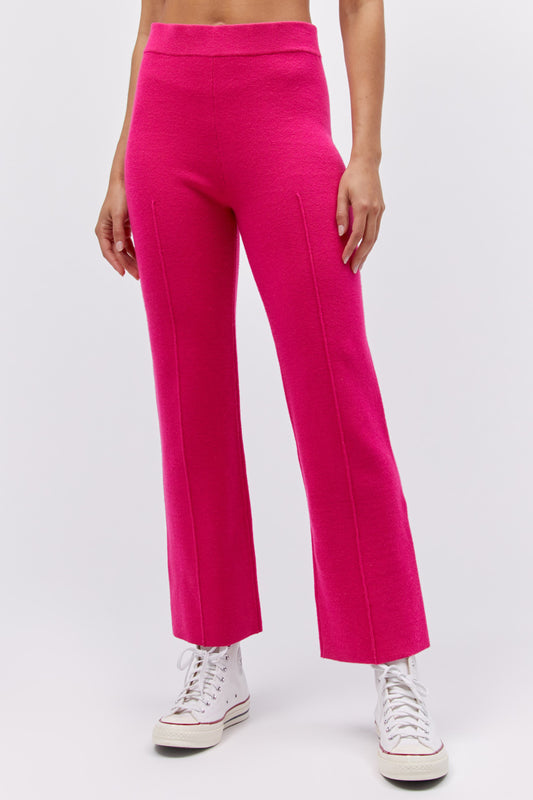 Model wearing a knit pintuck pant in pink rose.