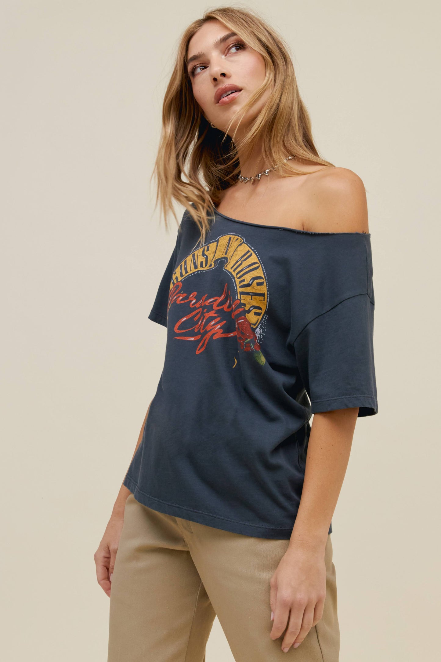 Blonde haired model featuring a vintage-inspired fit off shoulder tee.