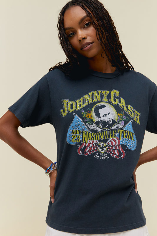 A model featuring a black tee adorned with "Johnny Cash" graphic in the center