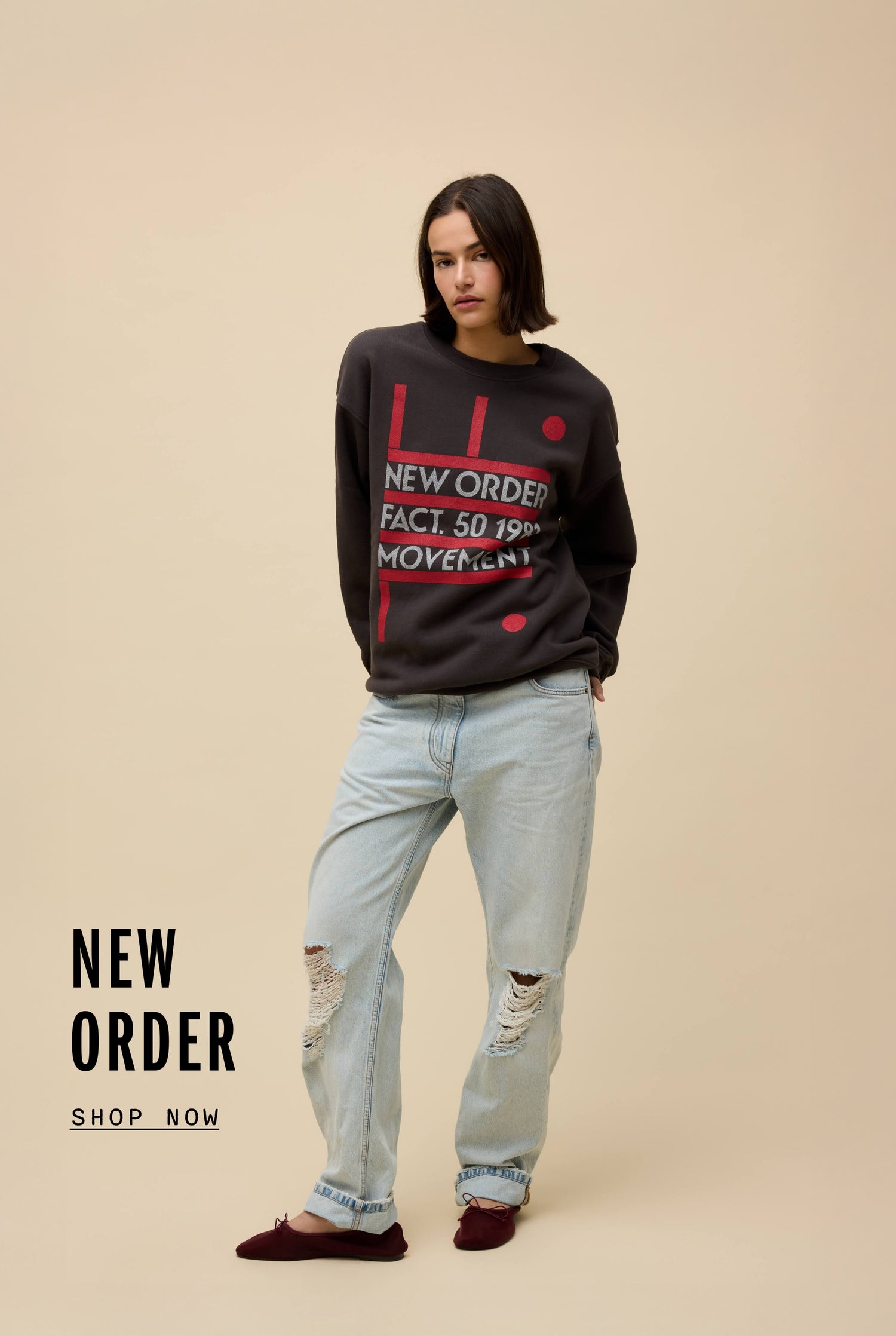 Model wearing a black New Order 'Movement' album graphic sweatshirt 