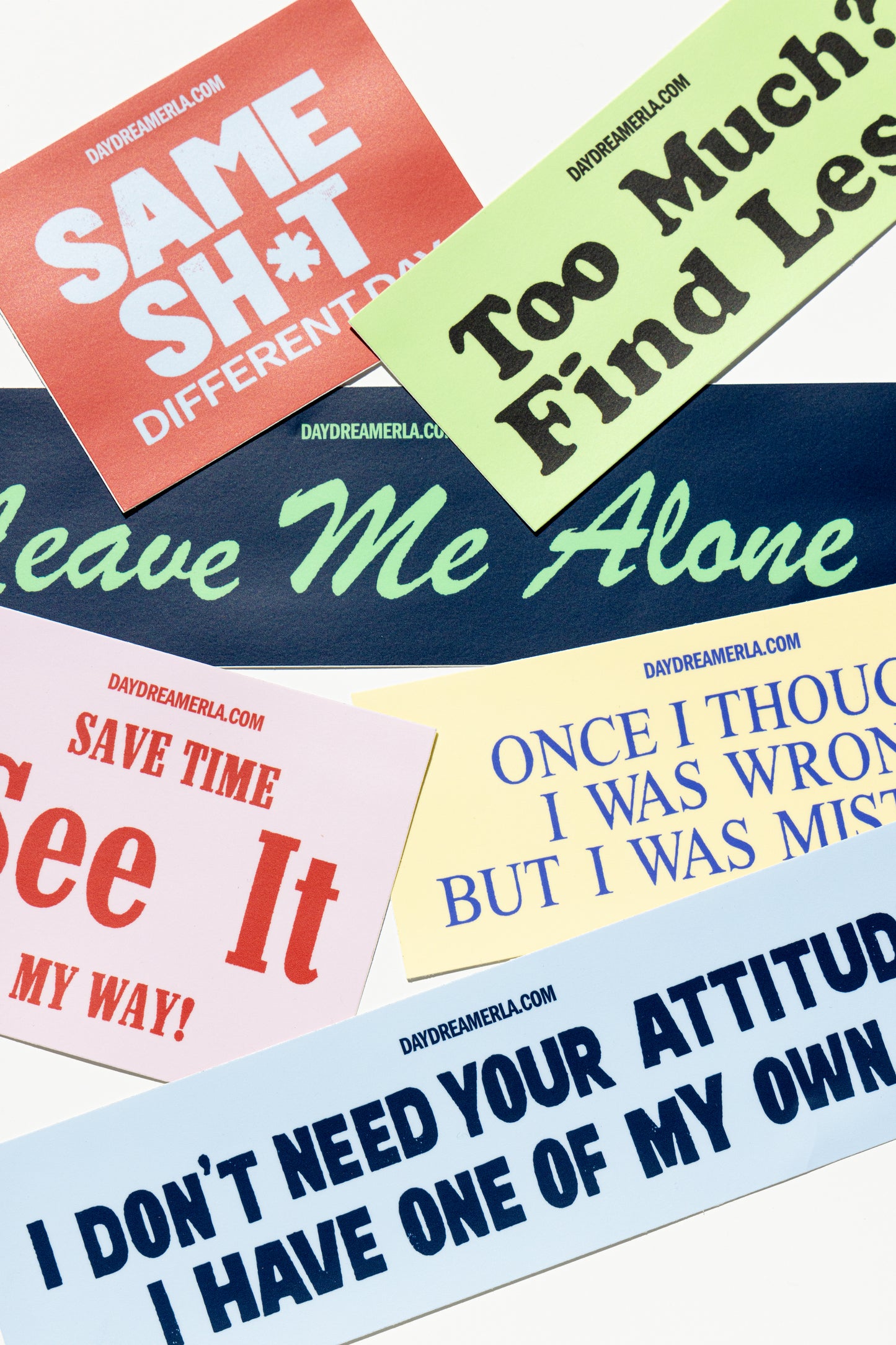 Bumper stickers with 'Tongue In Cheek' slogan graphics in a variety of sizes and colors