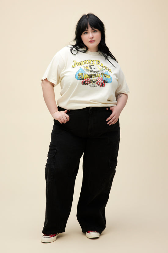 Plus size model wearing a cream shirt with Johnny Cash graphic at the center