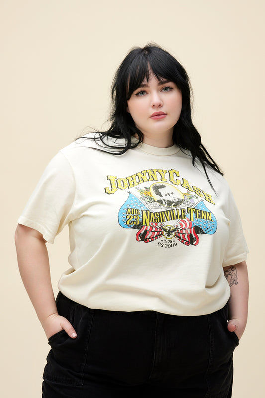Plus size model wearing a cream shirt with Johnny Cash graphic at the center