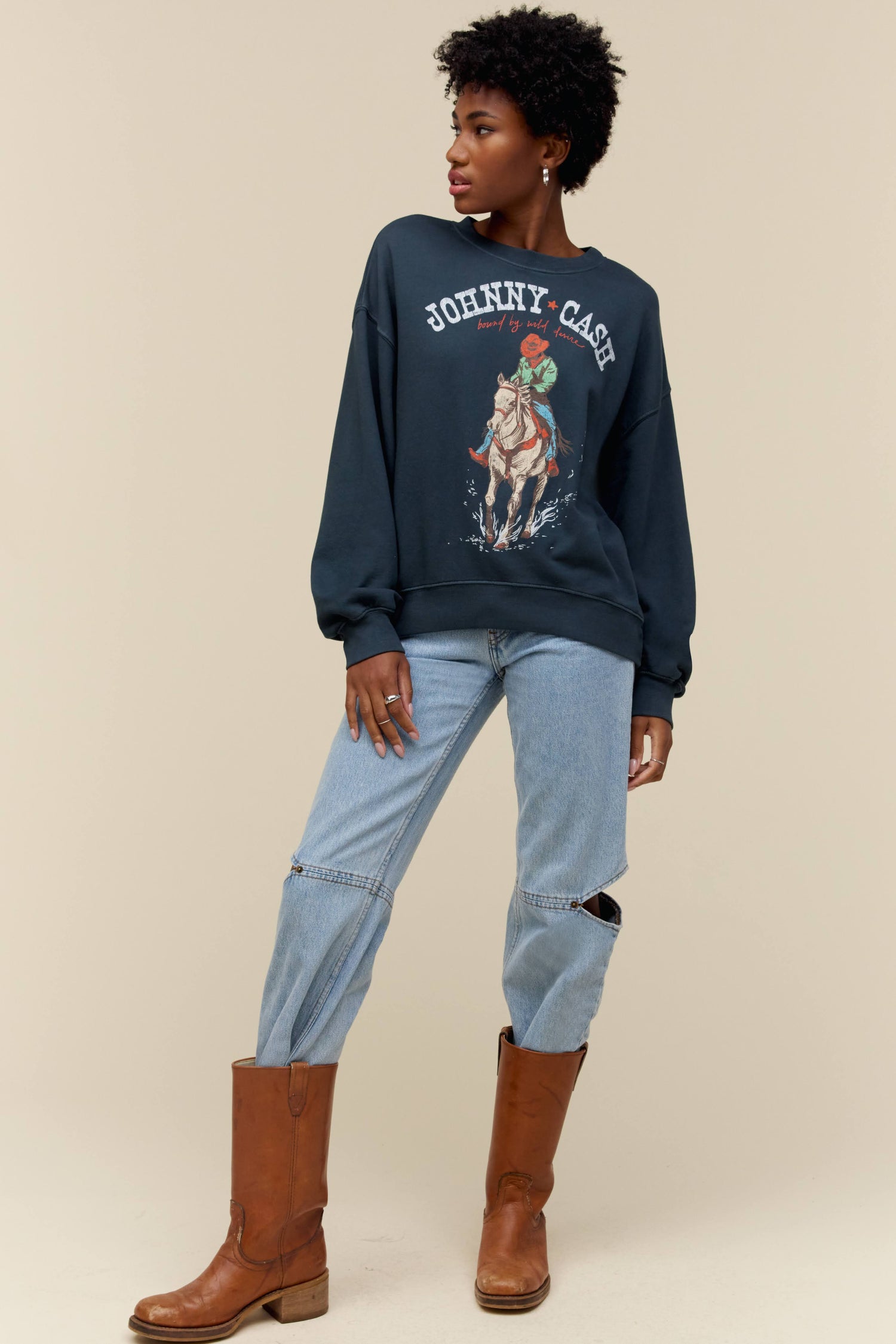 Model wearing a Johnny Cash graphic crewneck sweatshirt with an oversized fit