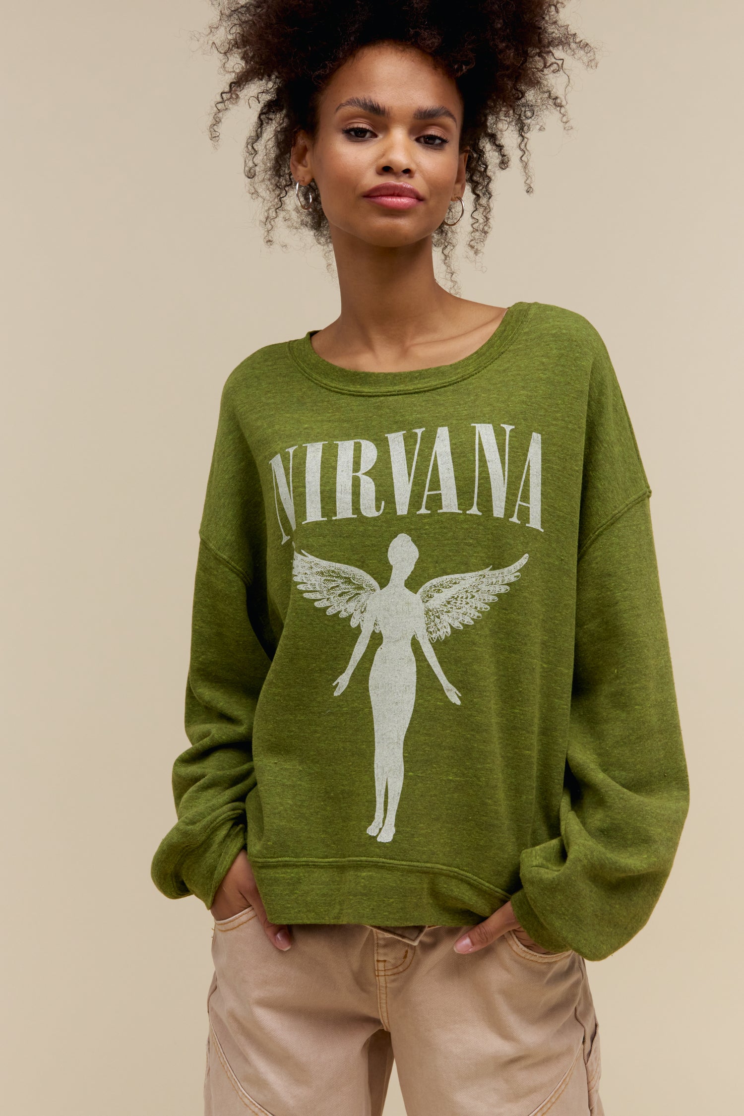 Model wearing a heather green oversized tri-blend fleece sweatshirt with Nirvana 'In Utero' graphics on the front and back