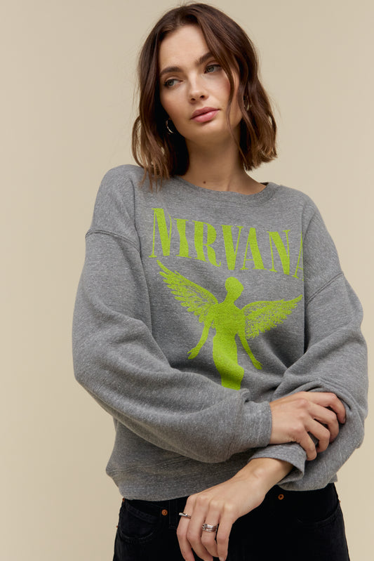 Model wearing an oversized tri-blend fleece sweatshirt with Nirvana 'In Utero' graphics stamped on the front and back