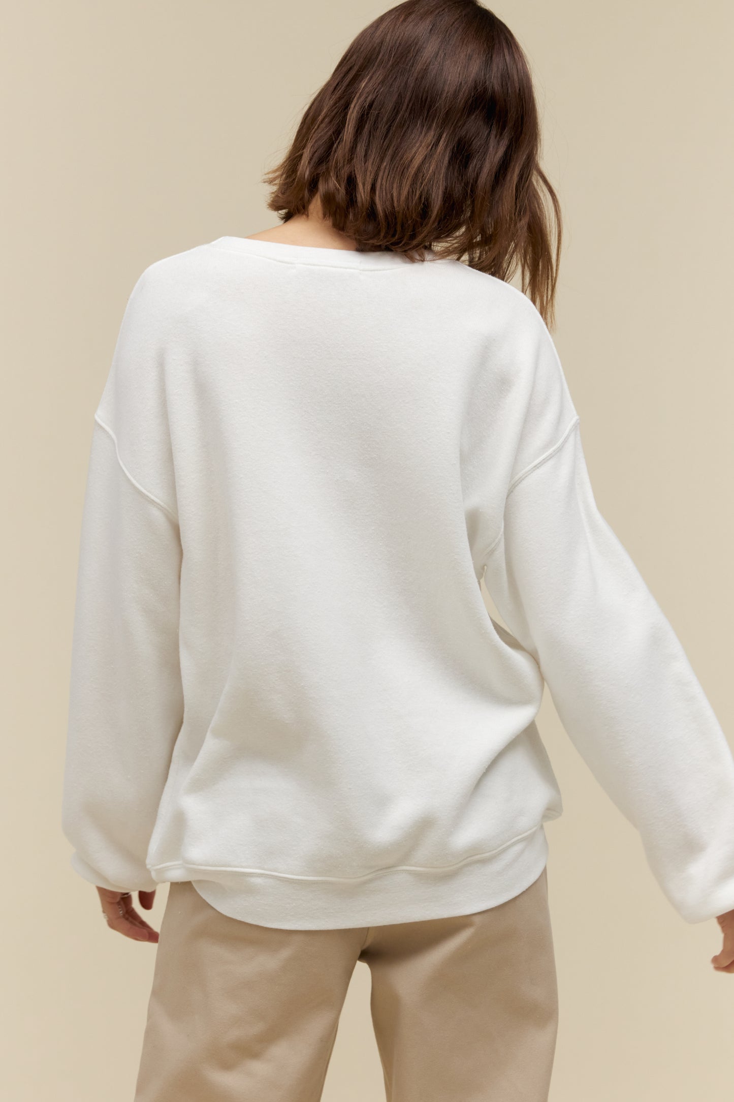 Model wearing a 'New York' collegiate style sweatshirt in a soft tri-blend fleece