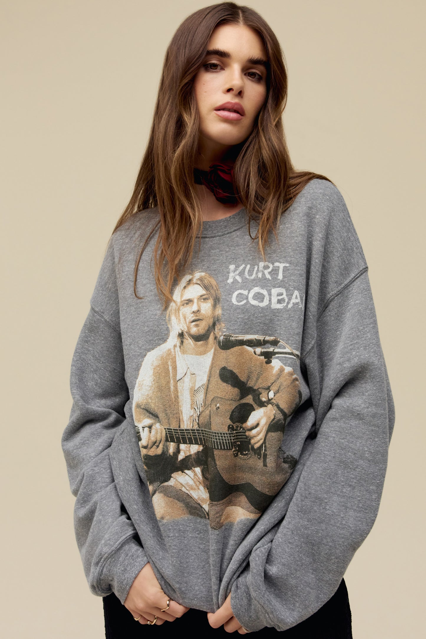 Model wearing a Kurt Cobain tri-blend fleece graphic sweatshirt in heather gray