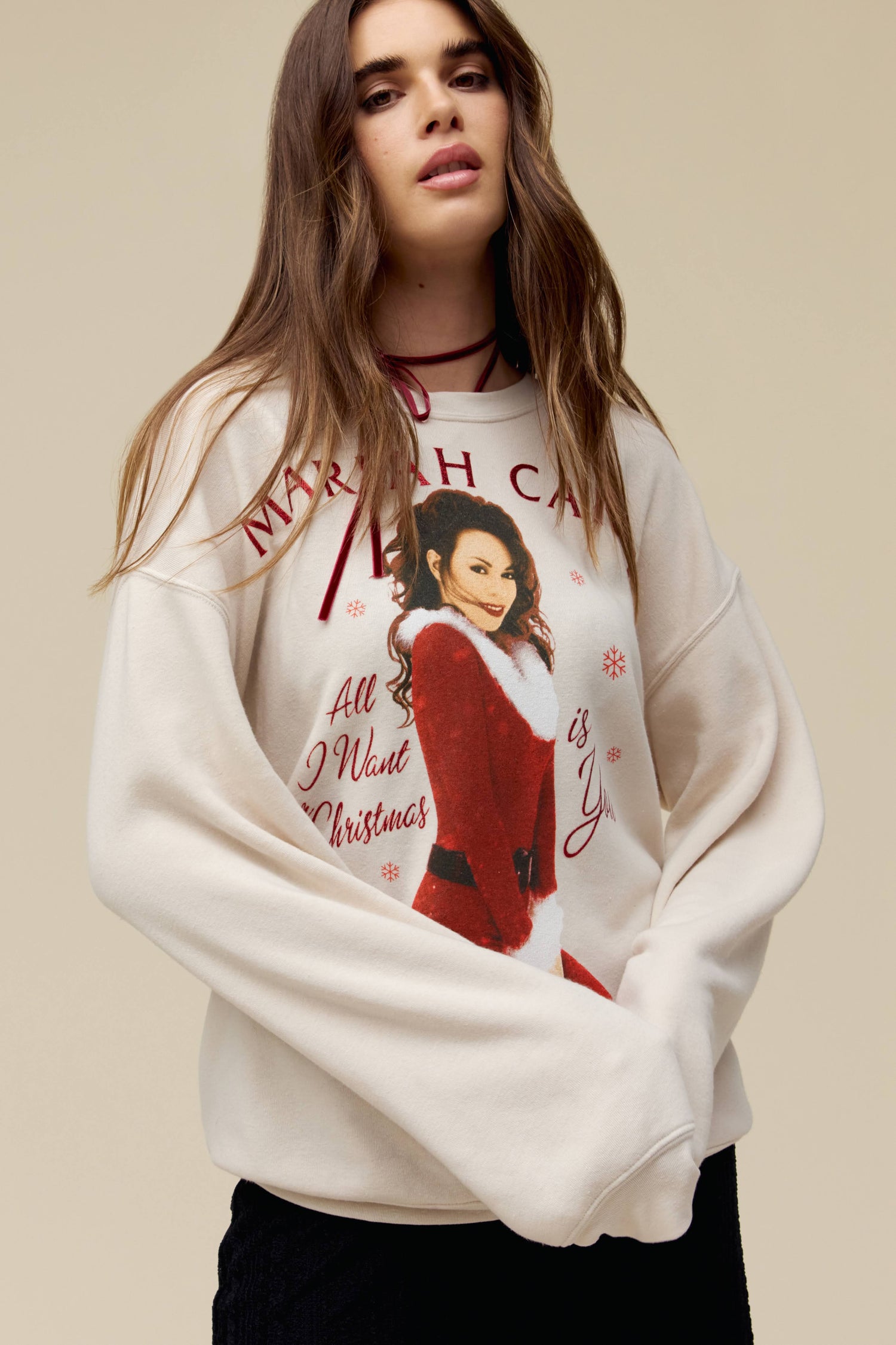 Model wearing a Mariah Carey tri-blend fleece sweatshirt featuring 'All I Want for Christmas is You' portrait artwork