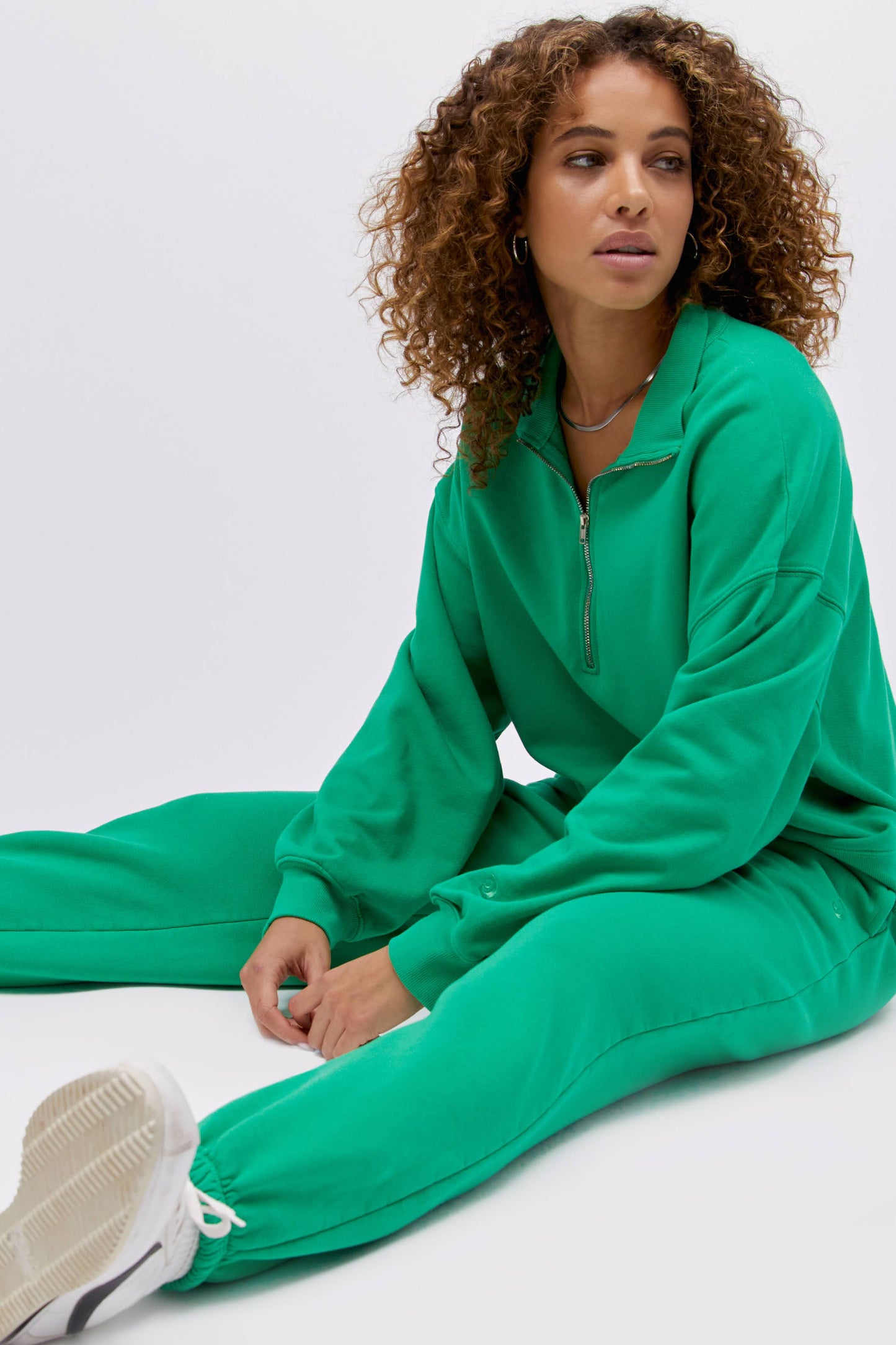 Model wearing a boyfriend sweatpant in lucky green.