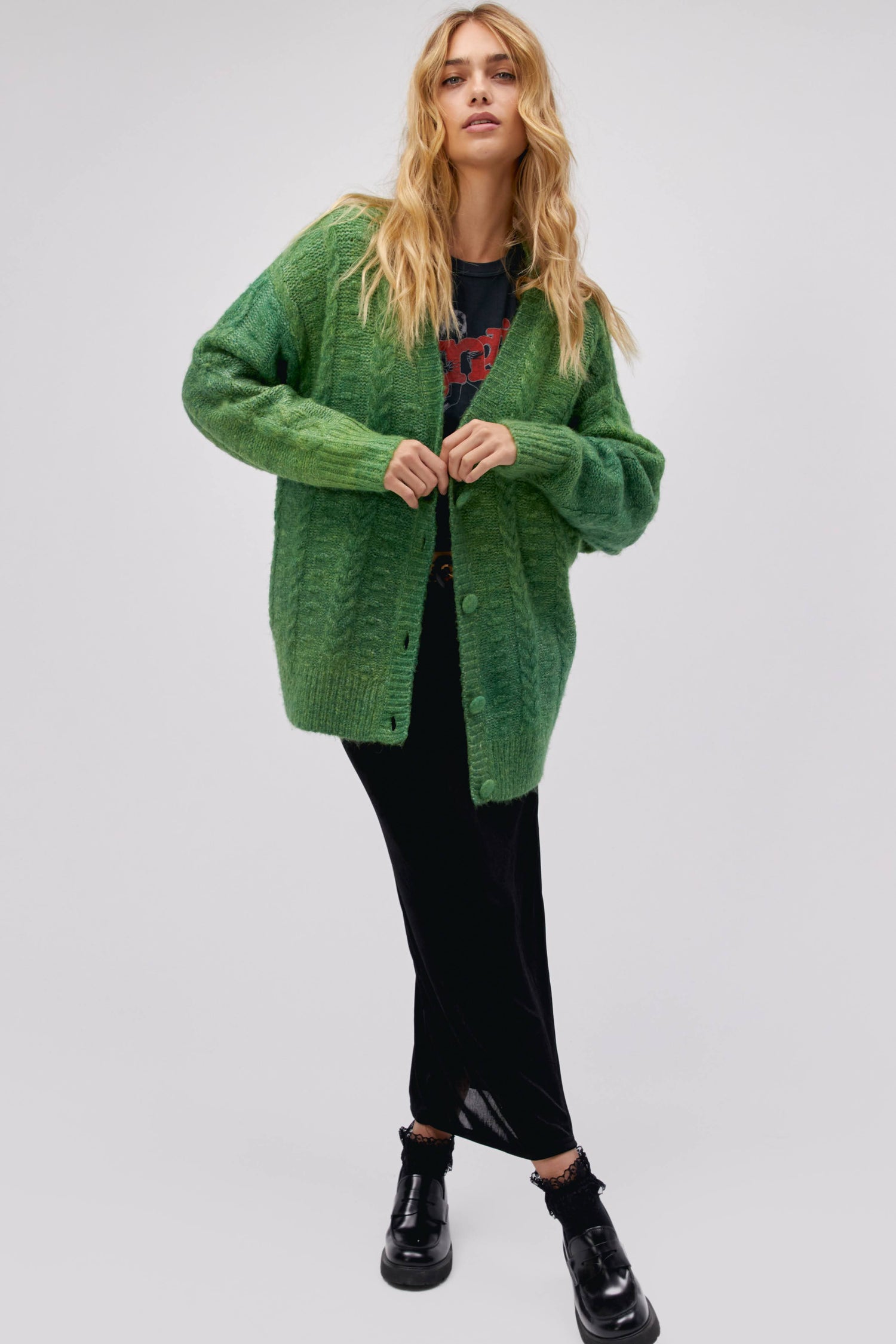 Model wearing an ombre cardigan in green jade.