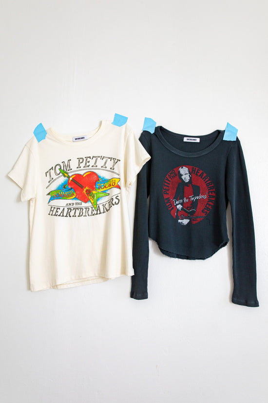 A Tom Petty and The Heartbreakers graphic tour tee and Tom Petty thermal shirt side-by-side.