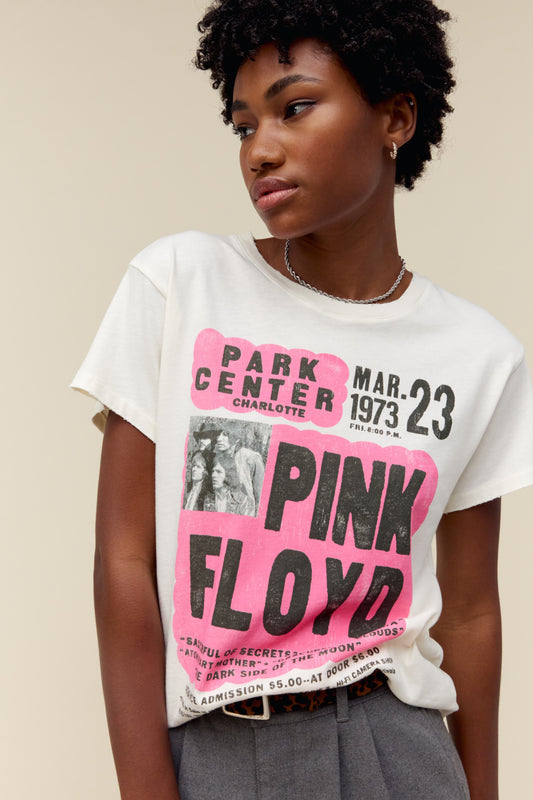 A model featuring a white tee designed as a true show flyer for Pink Floyd's 1973 Park Center set.