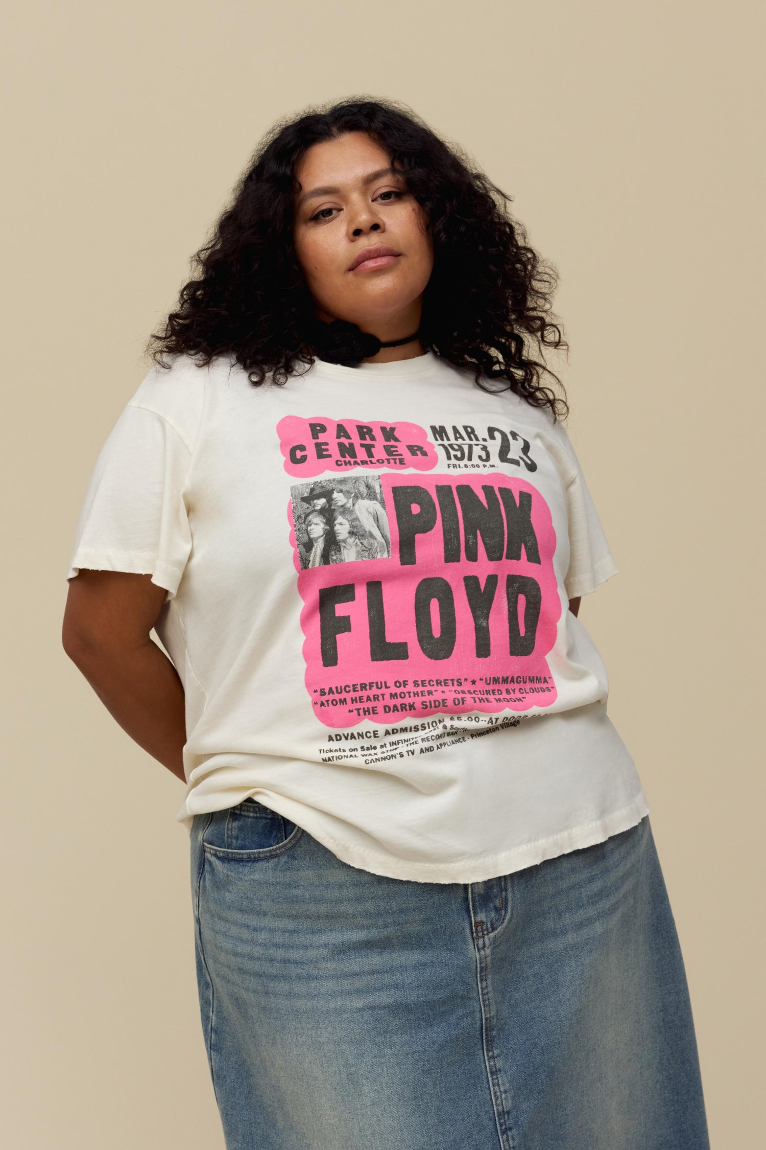 A model featuring a white tee es designed as a true show flyer for Pink Floyd's 1973 Park Center set.