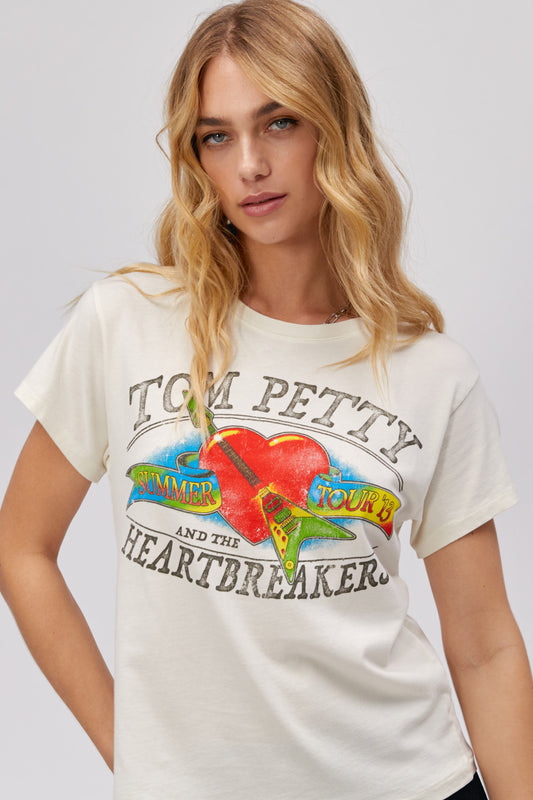 Model wearing a Tom Petty and The Heartbreakers Summer '13 Tour graphic tee.