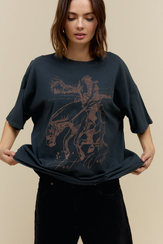 Model wearing an oversized Fort Worth graphic tee with sketched cowboy and horse artwork