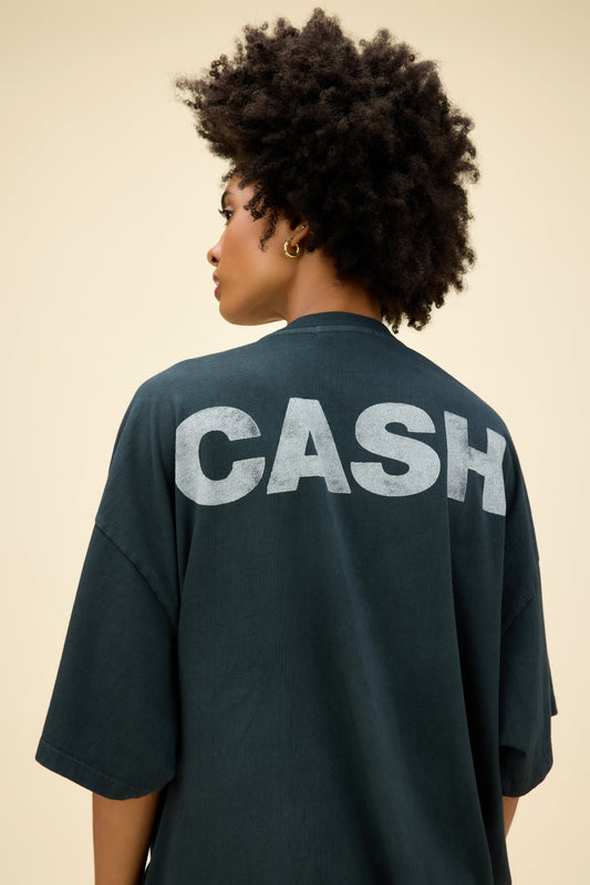 A model featuring a black os tee designed with a graphic of a man in the middle and stamped with Cash at the back.