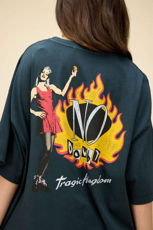 Model wearing an oversized No Doubt Tragic Kingdom graphic tee with album and flame artwork on the front and back.