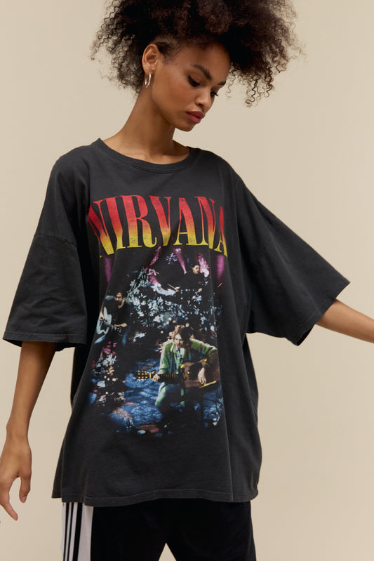 Model wearing a Nirvana MTV Unplugged graphic tee in pigment dyed black with an exaggerated oversized fit
