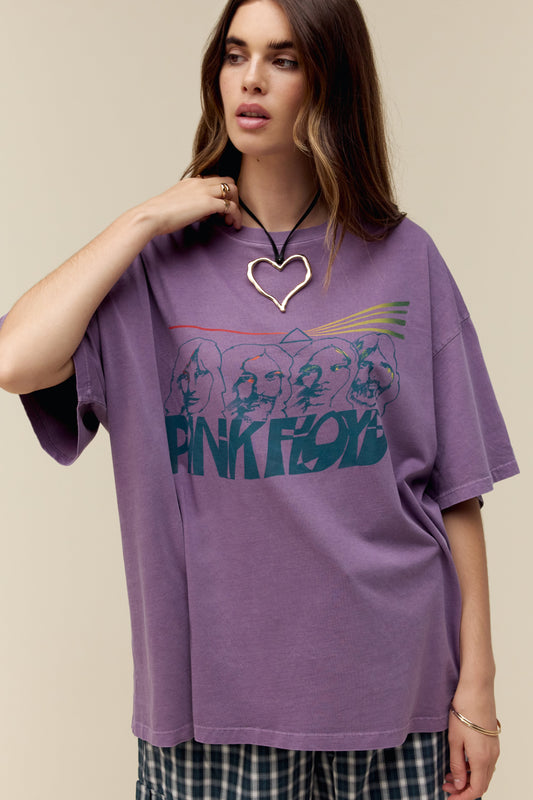 A model featuring a purple colored OS tee accented with "Pink Floyd" in warped font and their enduring light prism symbol.