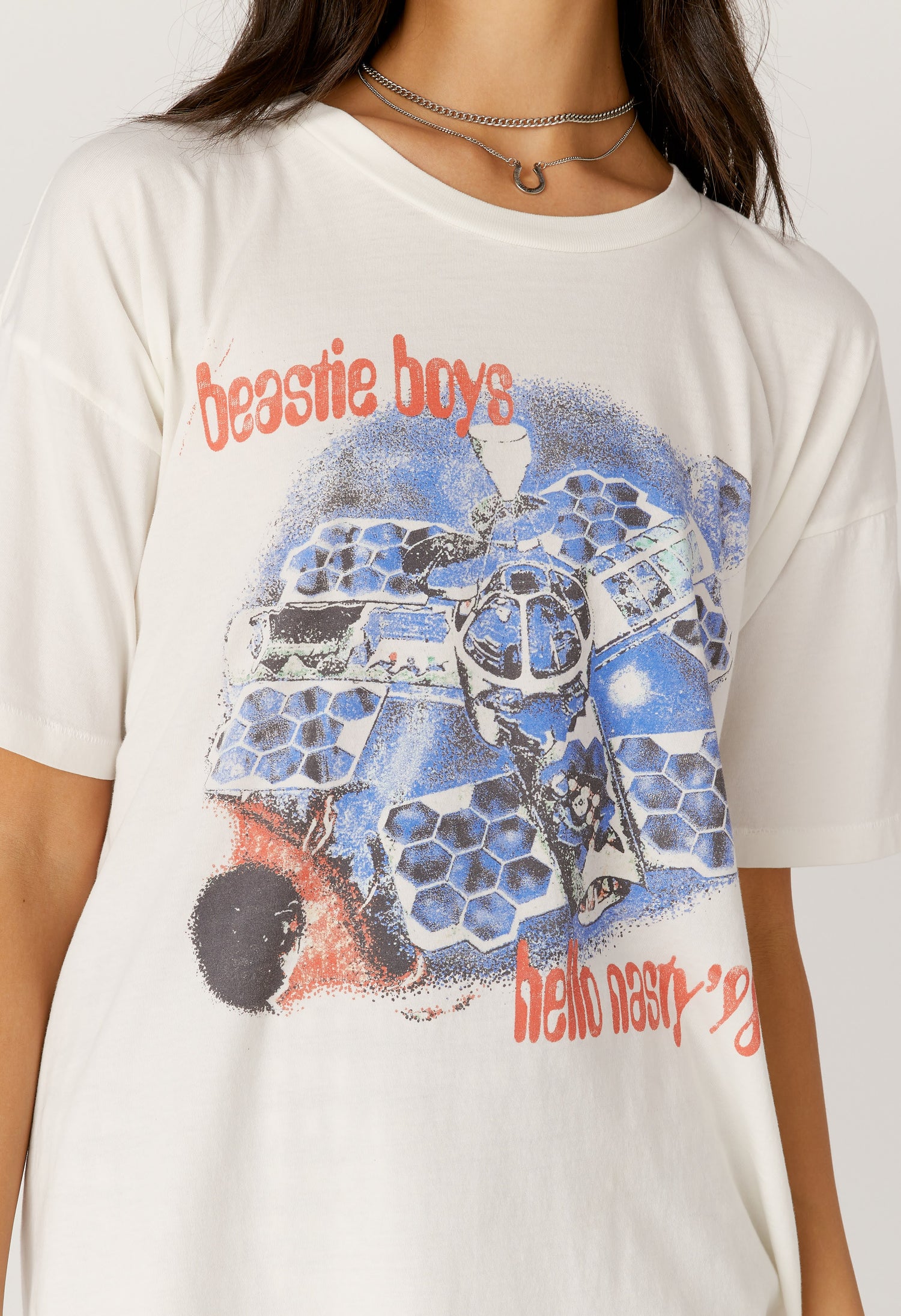 Model wearing a Beastie Boys 'Hello Nasty' tour graphic tee in vintage white