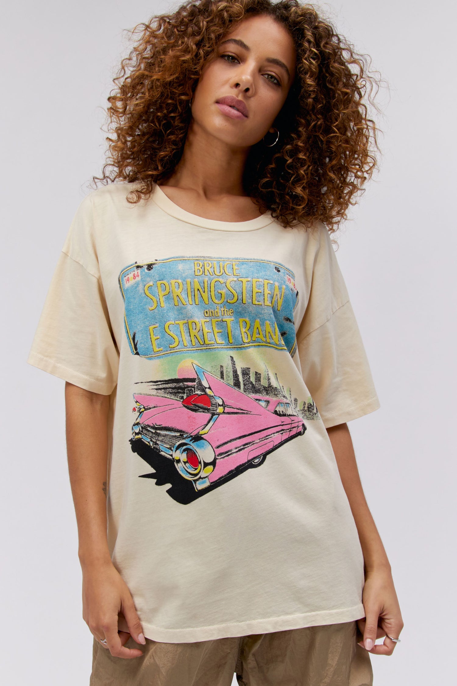 Model with Curly Hair wearing a Bruce Springsteen Graphic Tee
