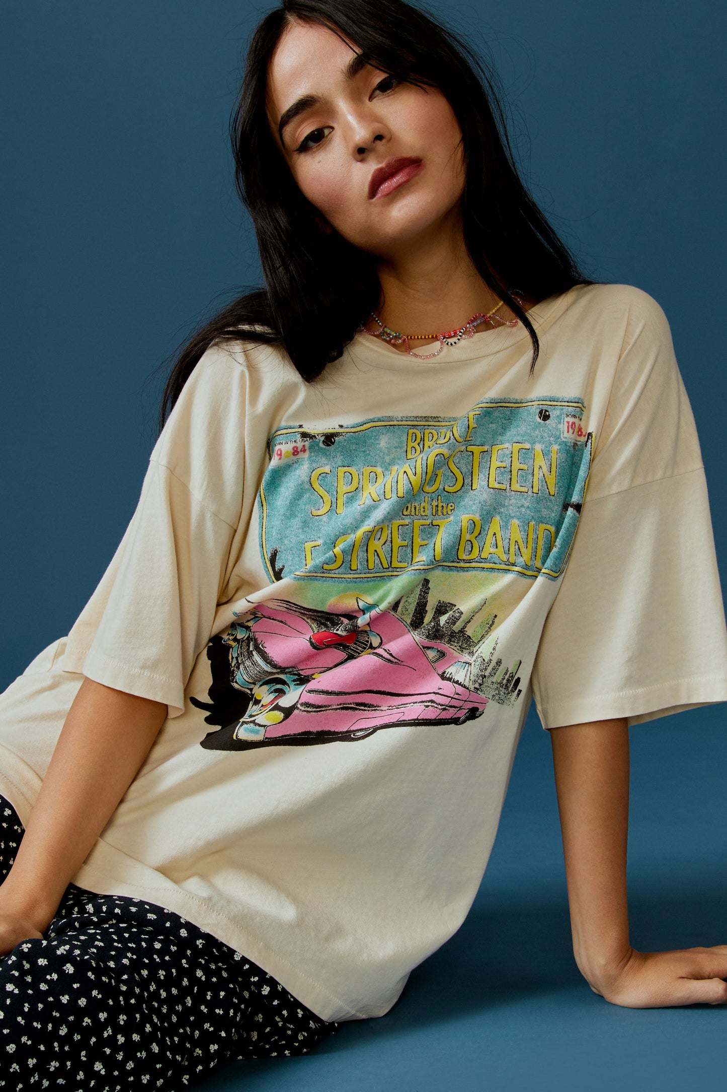 Model with Straight Hair wearing a Bruce Springsteen Graphic Tee