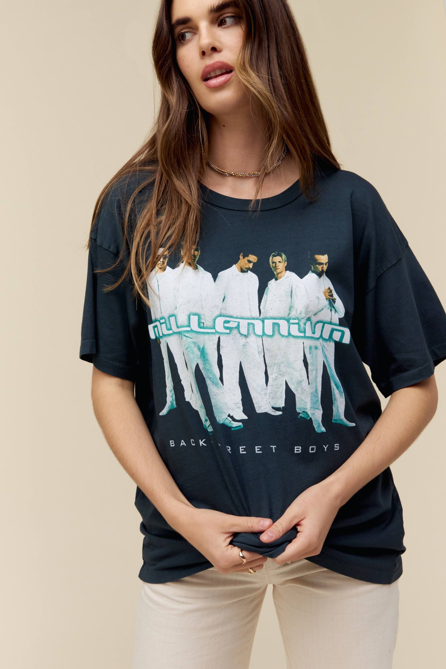 Model wearing a Backstreet Boys graphic tee featuring artwork of their third studio album 'Millennium'