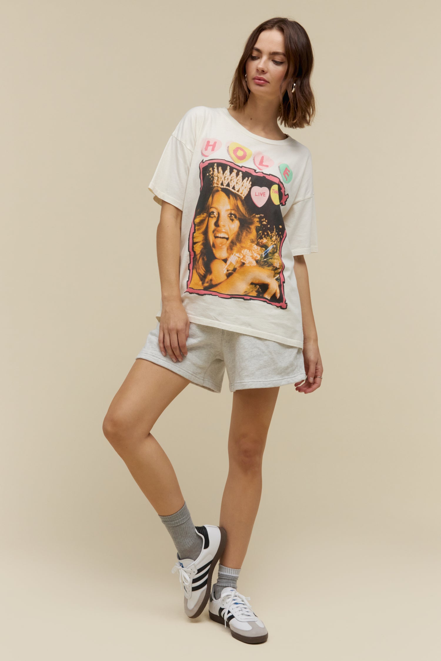 Model wearing a 90s Hole merch tee with grungy, poster style designed with the original artwork from Hole’s second studio album “Live Through This.” The tour details stamped along the back.