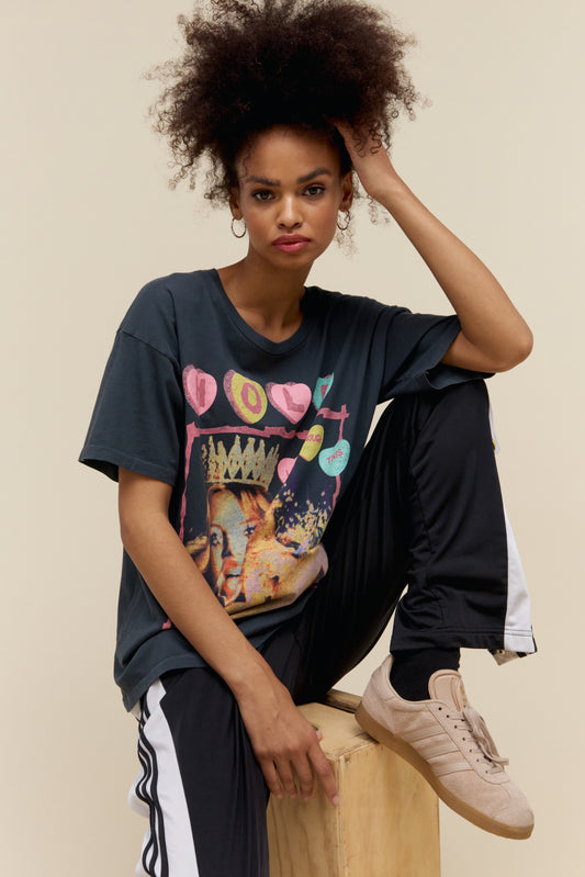 Model wearing a graphic tee of the original artwork from Hole’s second studio album “Live Through This" and tour details stamped along the back.