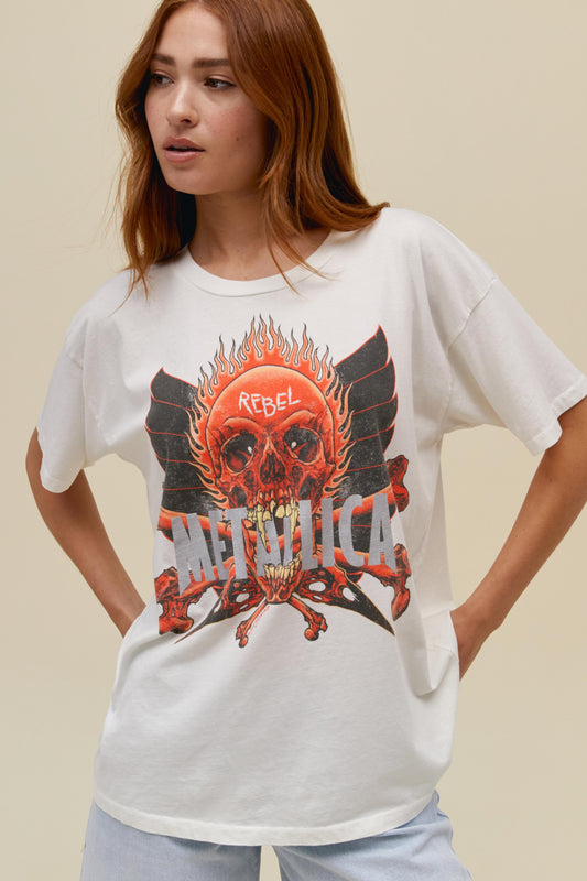 A model featuring a white merch tee designedd with a graphic of a skull in the middle