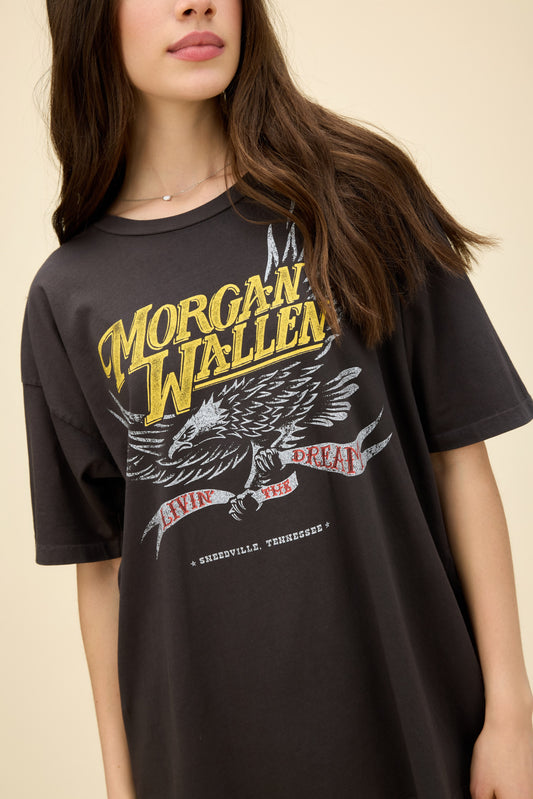 Model wearing a roomy fit graphic tee in black with Morgan Wallen 'Livin The Dream' eagle artwork on the front.