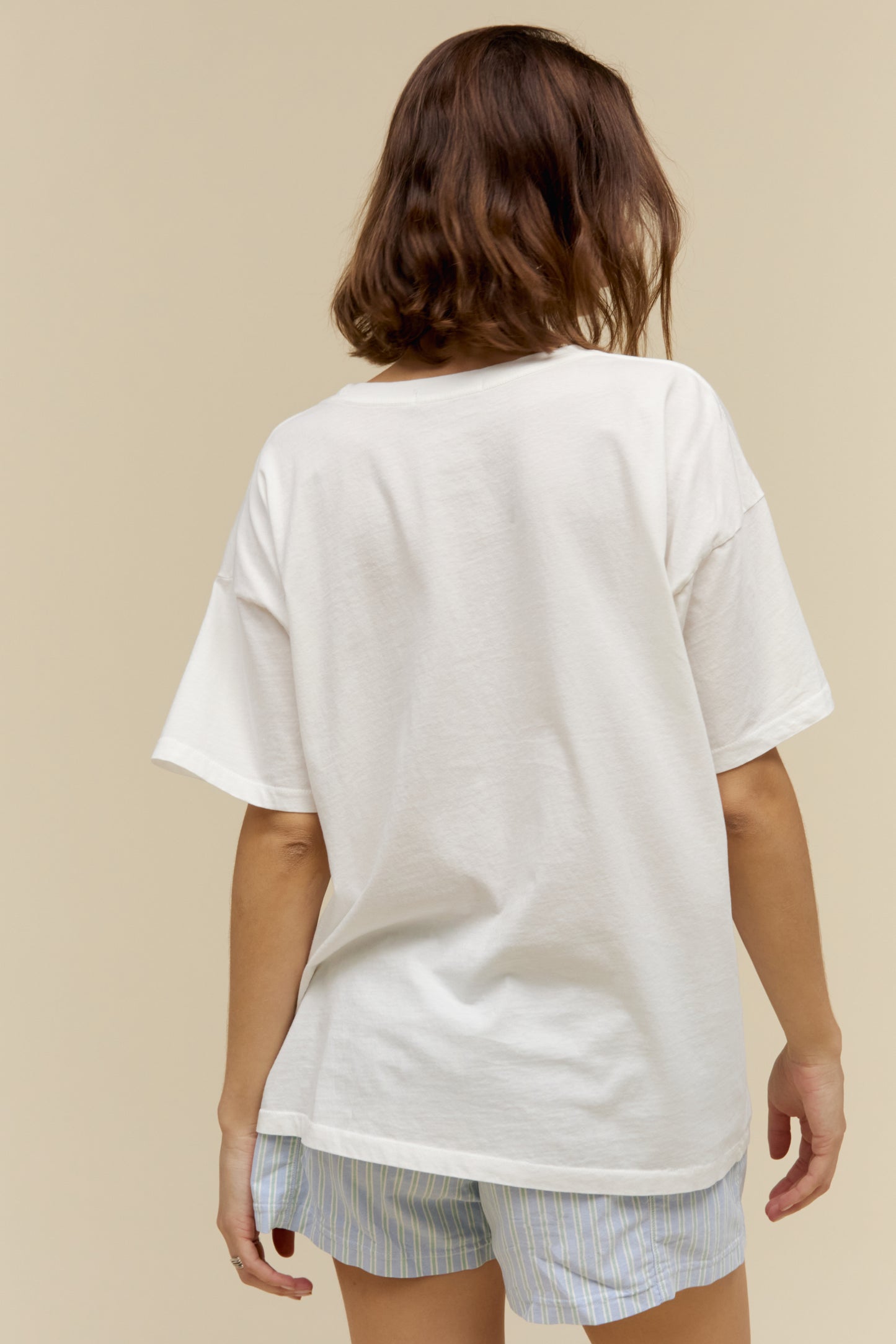 Model wearing a plain oversized t-shirt in vintage white