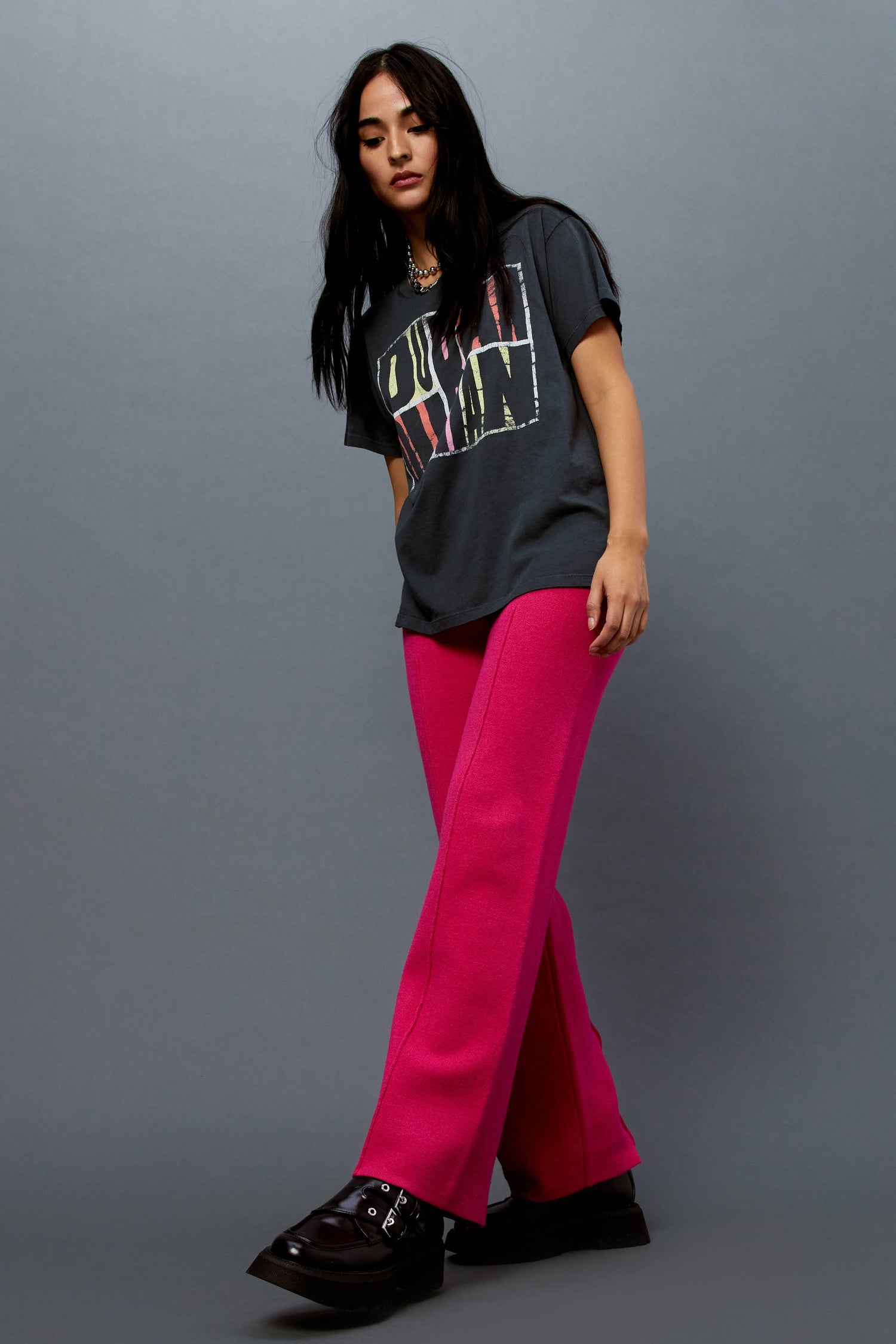 Model wearing a Duran Duran graphic tee styled with knit pintuck pants in pink rose