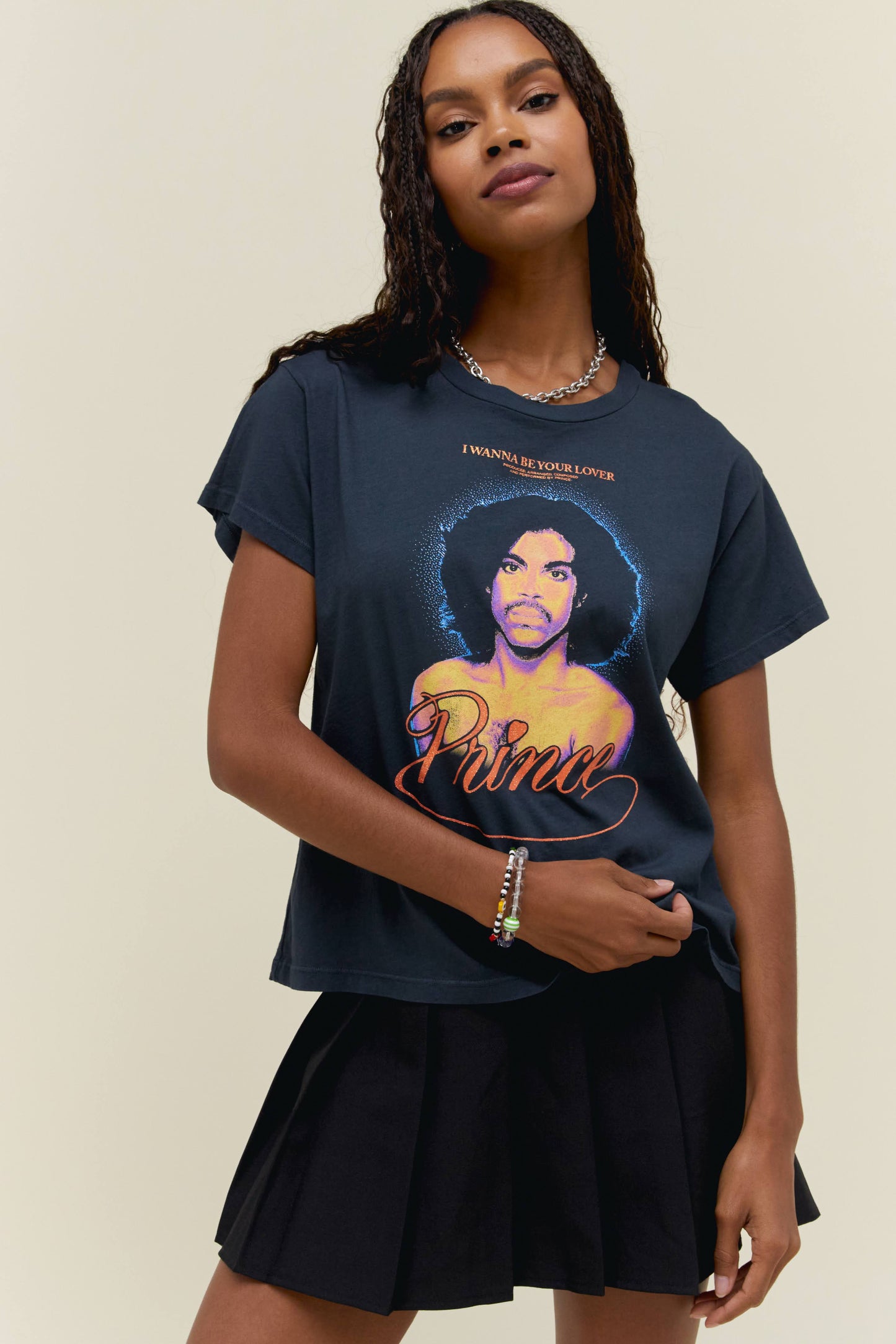 A model featuring a black solo tee and a portrait of the artist itself on the center.