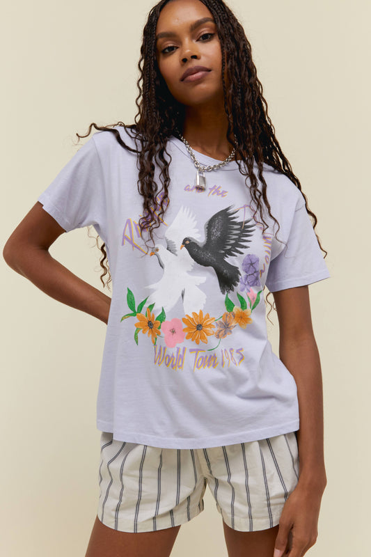 A model featuring a lilac ringer tee  design with white and black dove