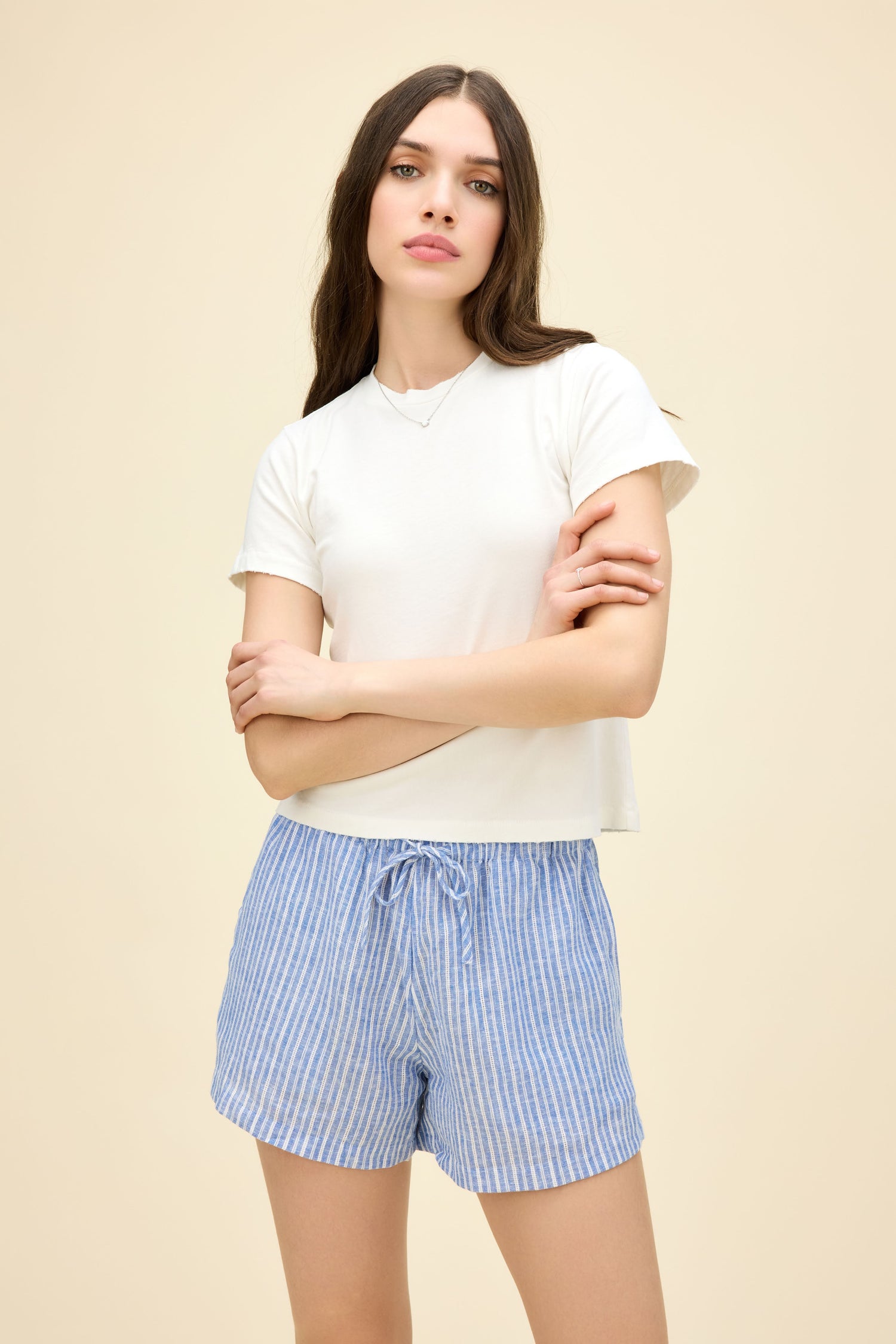 A model featuring a vintage tee in vintage white.