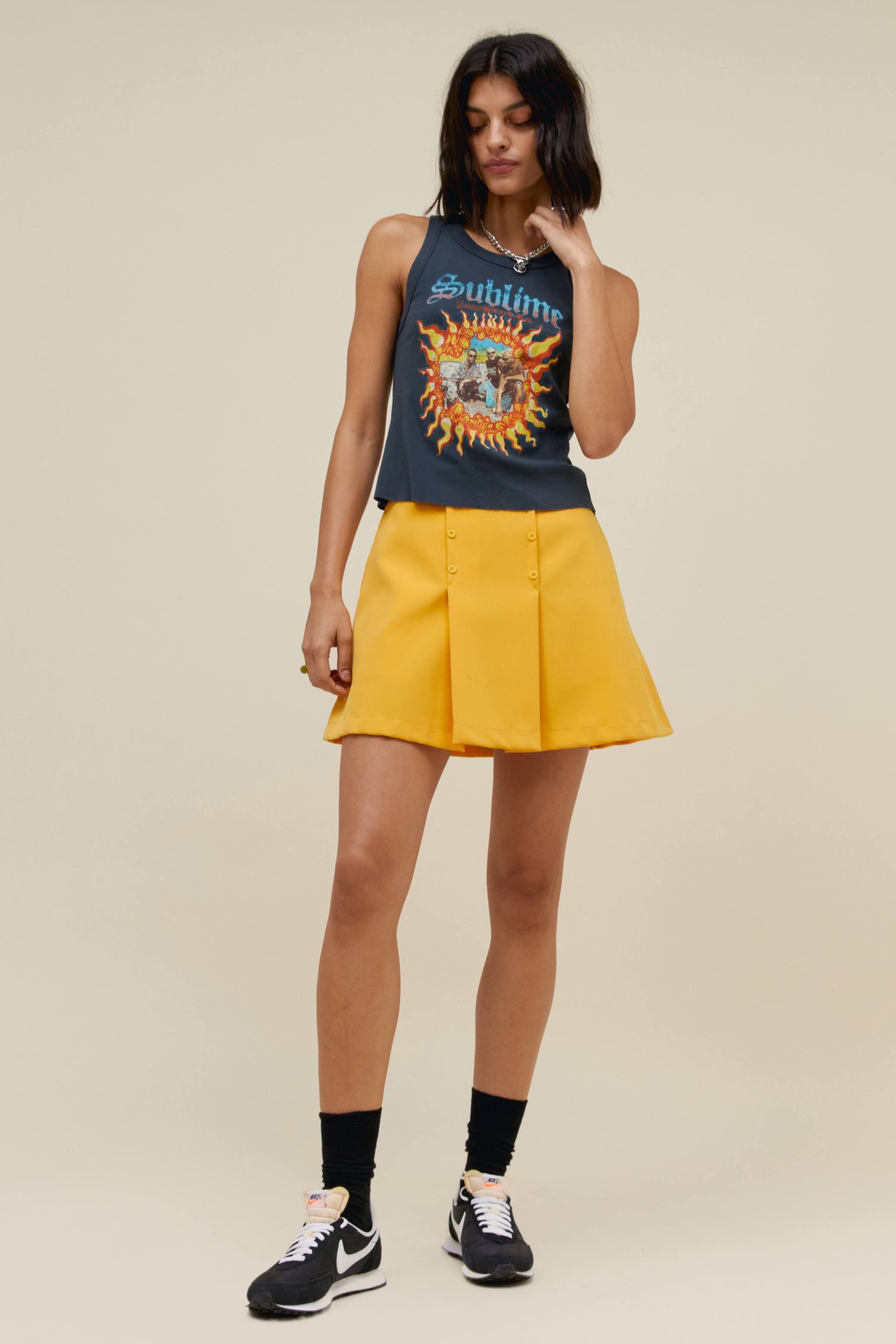 yellow mini skirt with Sublime tank
