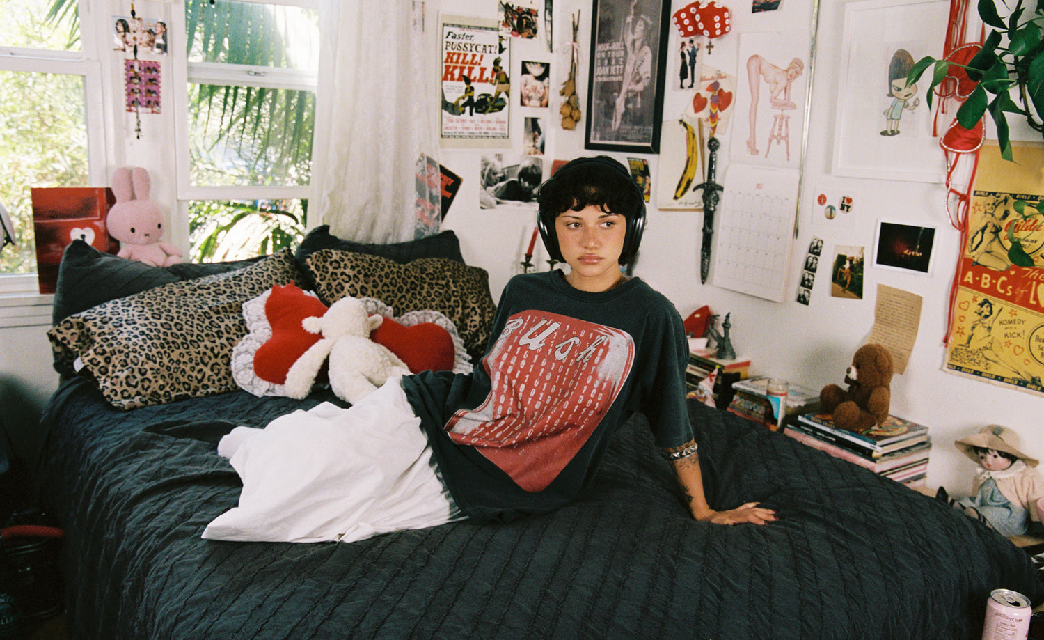 Model wearing a Bush graphic tee in vintage black with an oversized fit.