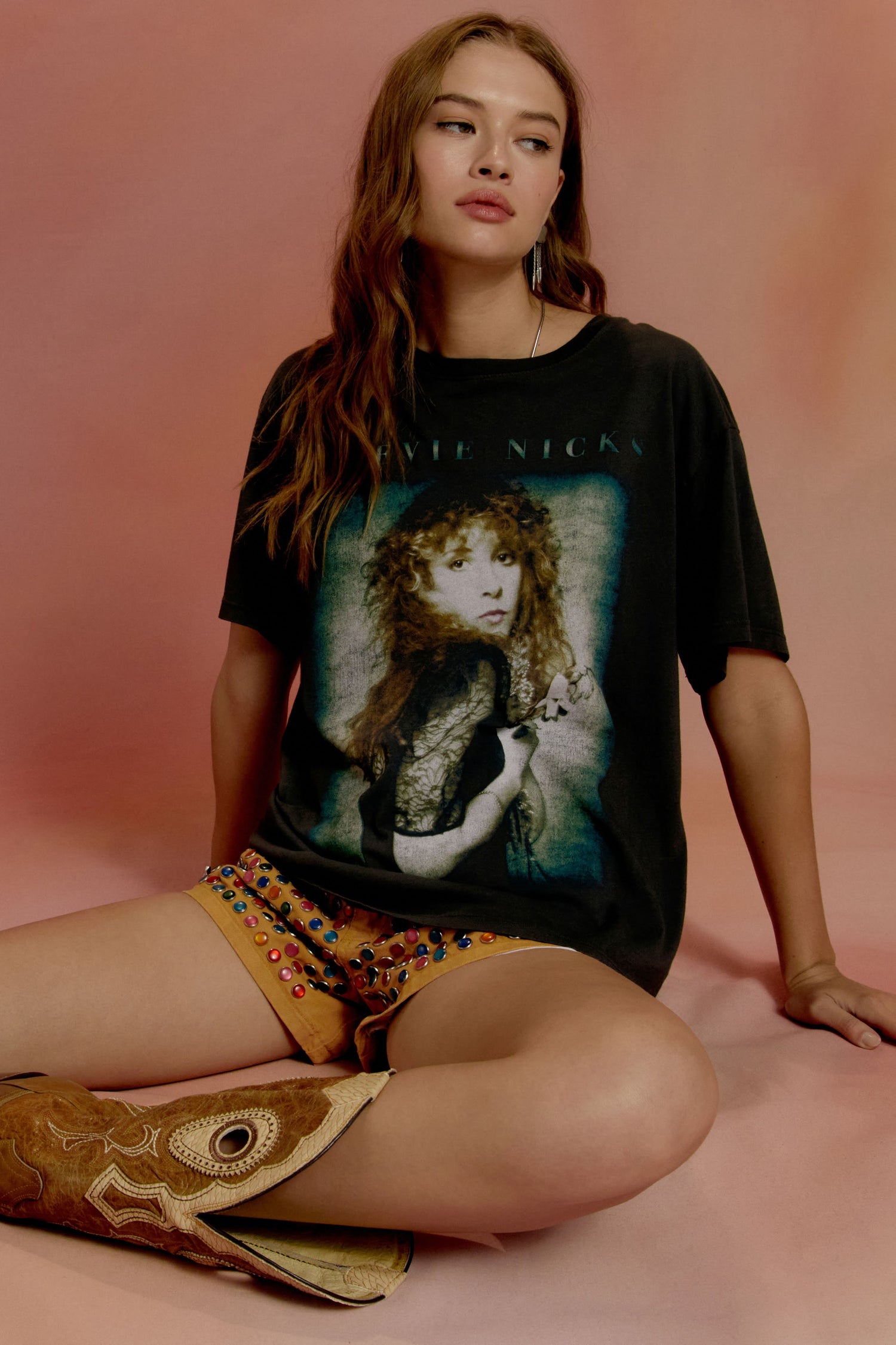 Brown-haired model featuring a back tee designed with a portrait of the leading lady in a mastered distressed technique.