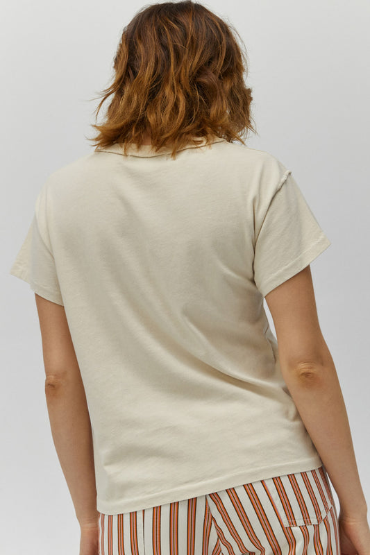 white tee designed with a portrait of the artist