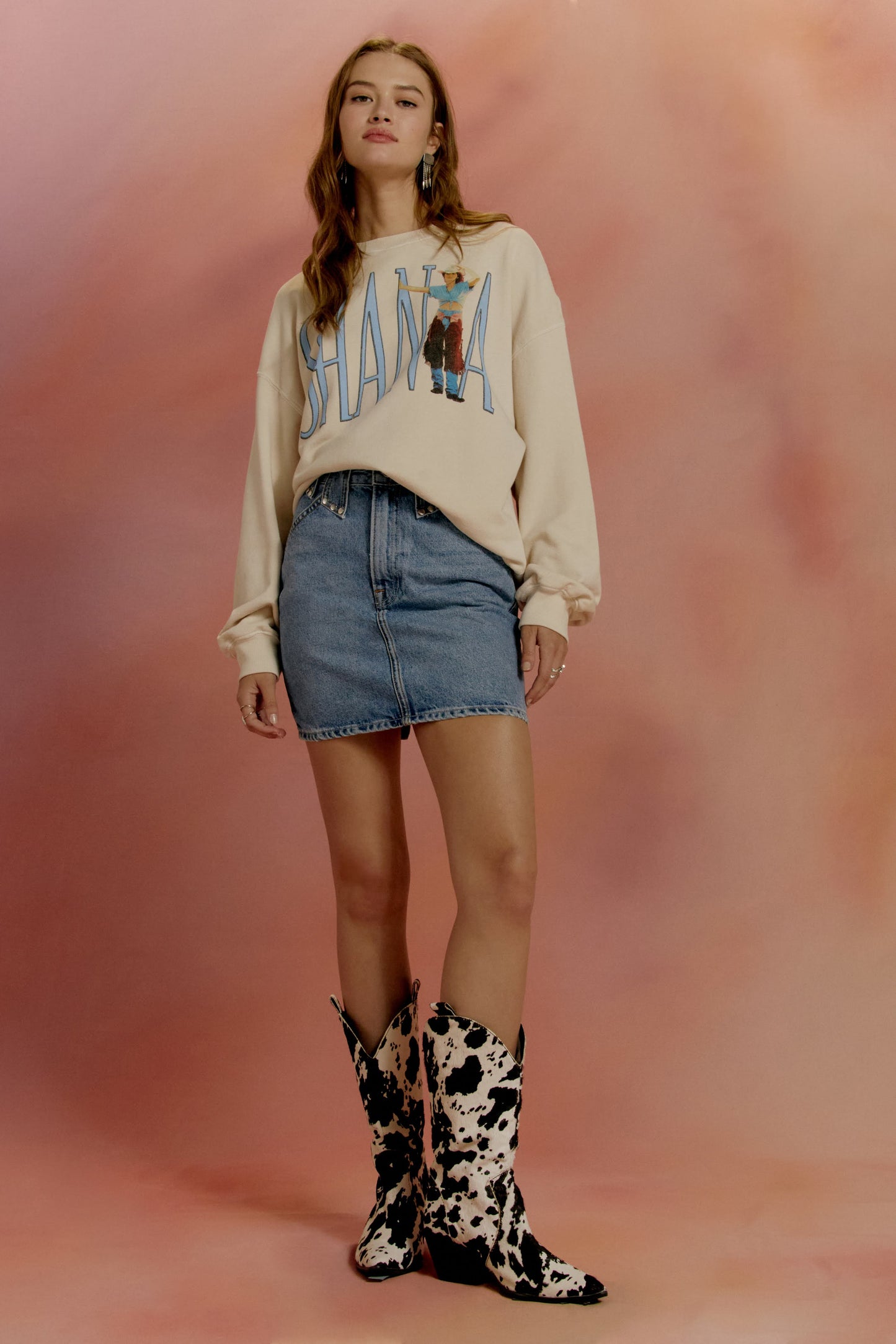 cowboy boots with denim skirt and crew