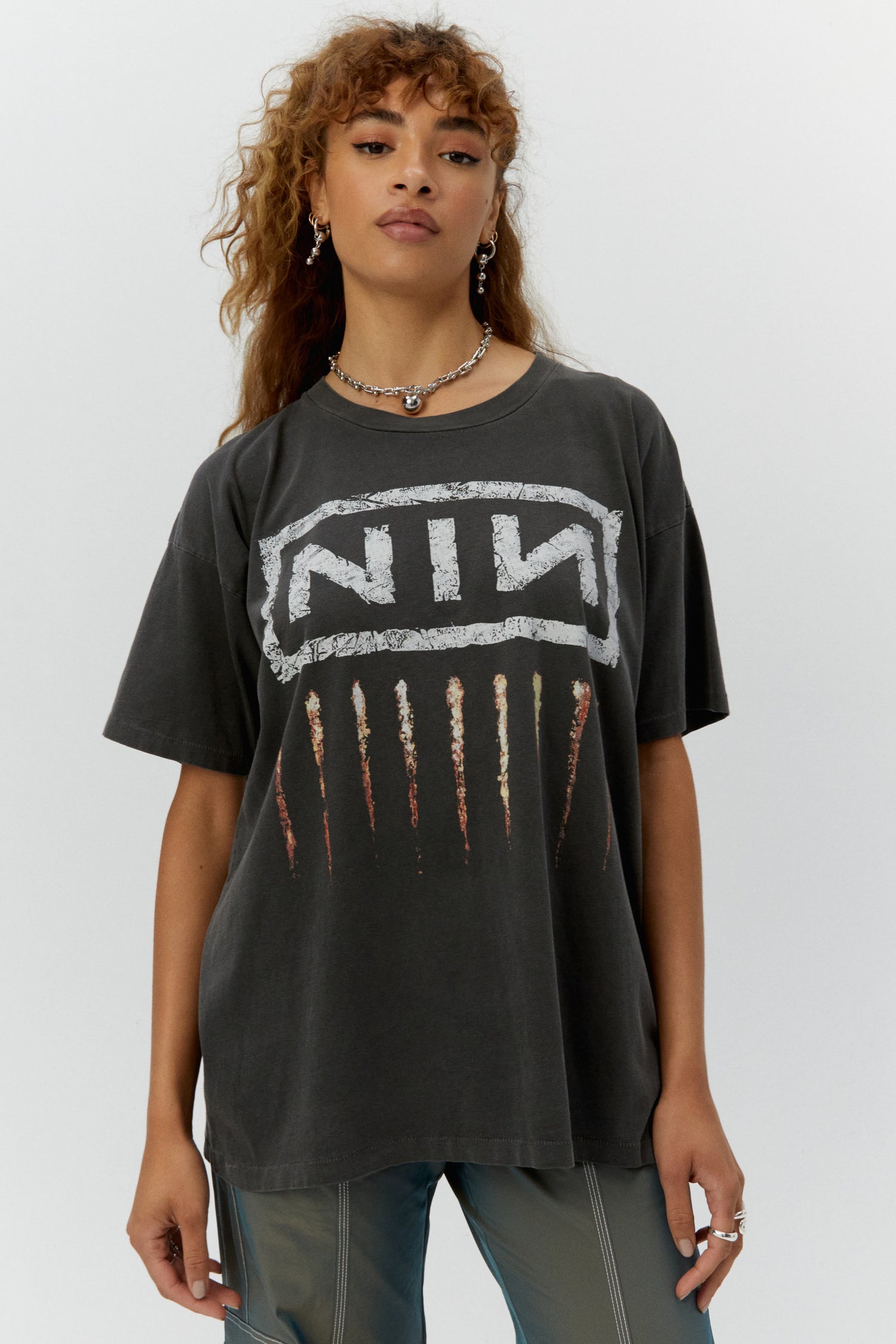 black tee designed with the band's logo NIN
