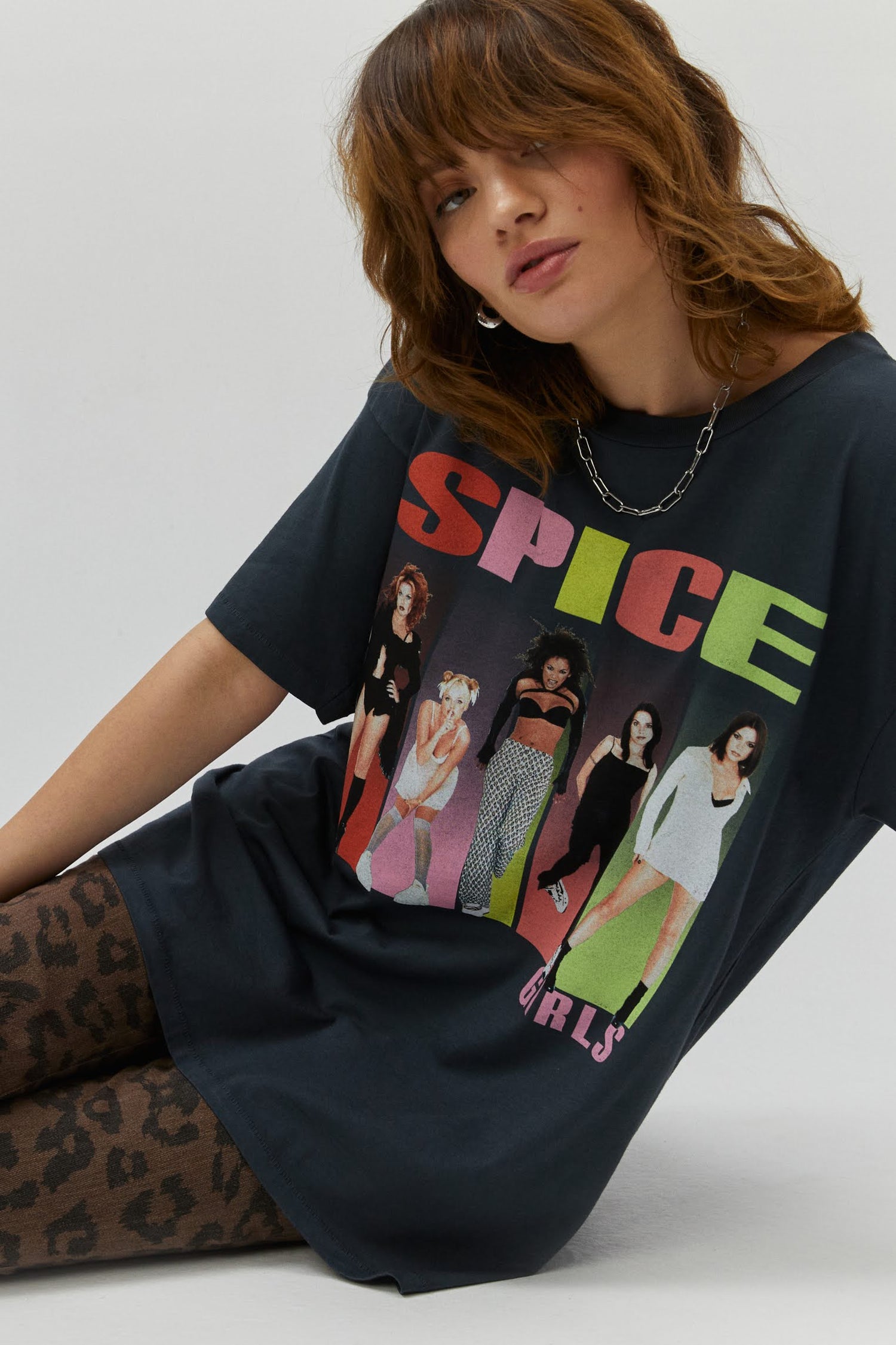 black tee designed with the "Spice Up Your Life"
